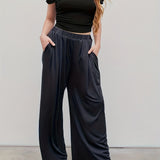 Plus Size Casual Pants, Women's Plus Solid Elastic High Rise Medium Stretch Loose Fit Wide Leg Trousers With Pockets